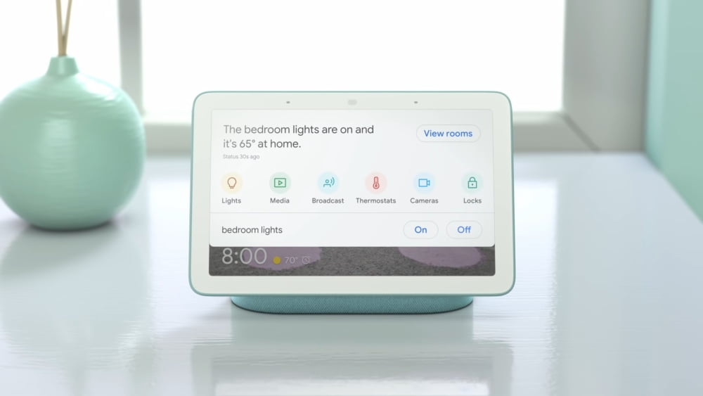 The smart on-screen speaker, Google Nest Hub, displays a smart home menu.