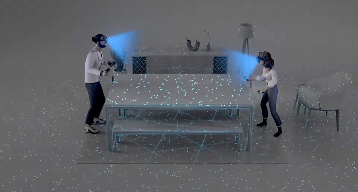 Eine Frau und ein Mann spielen virtuelles Tischtennis auf einem echten Tisch.