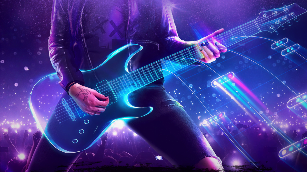 Ein Gitarrist spielt vor der VR-Spiel-Bühne.
