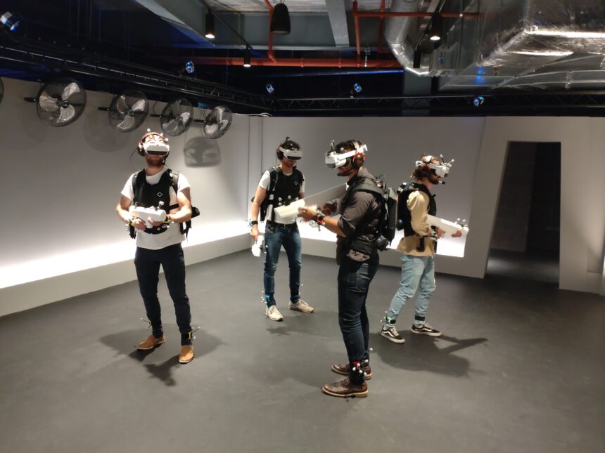A group of people wearing VR headsets and guns.