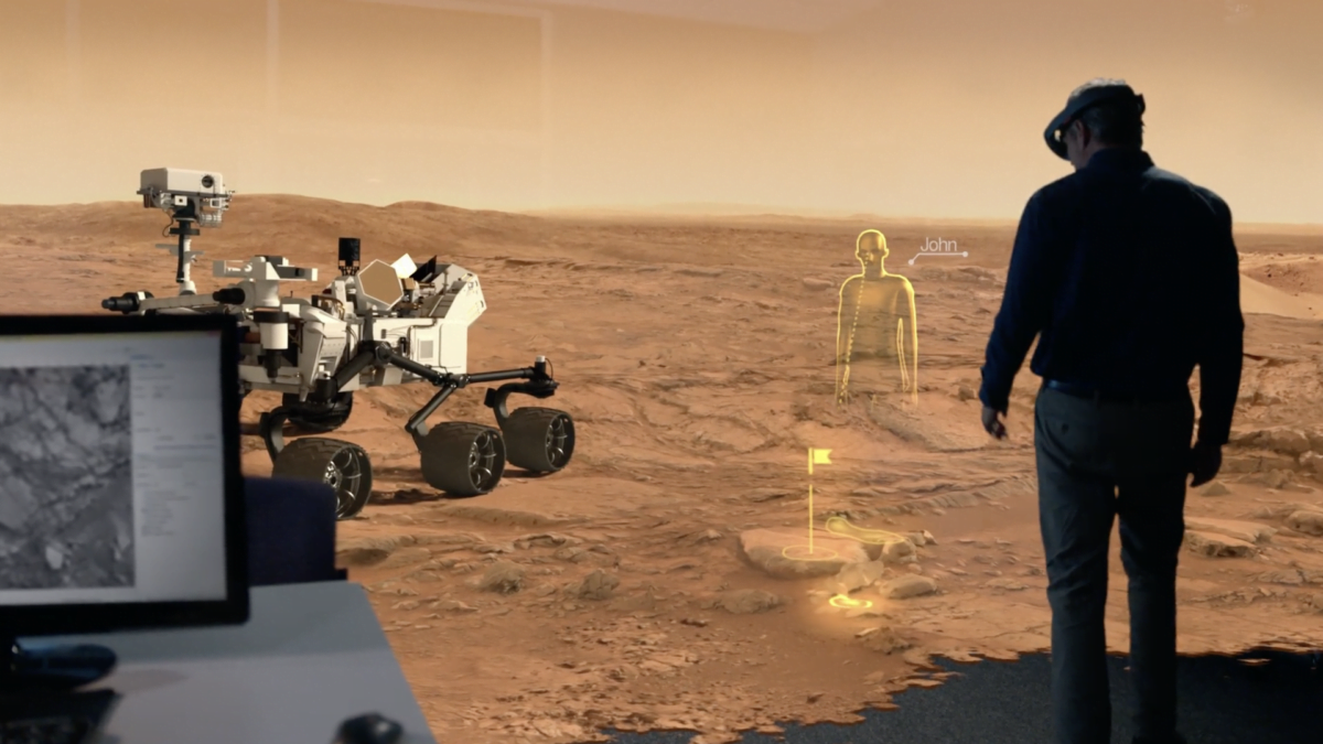 Ein Mann mit einer VR-Brille auf dem Kopf steht in einer Mars-Simulation.
