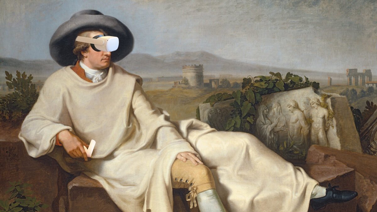Goethe mit Quest 2 und Controller halb liegend vor einer italienischen Landschaft.