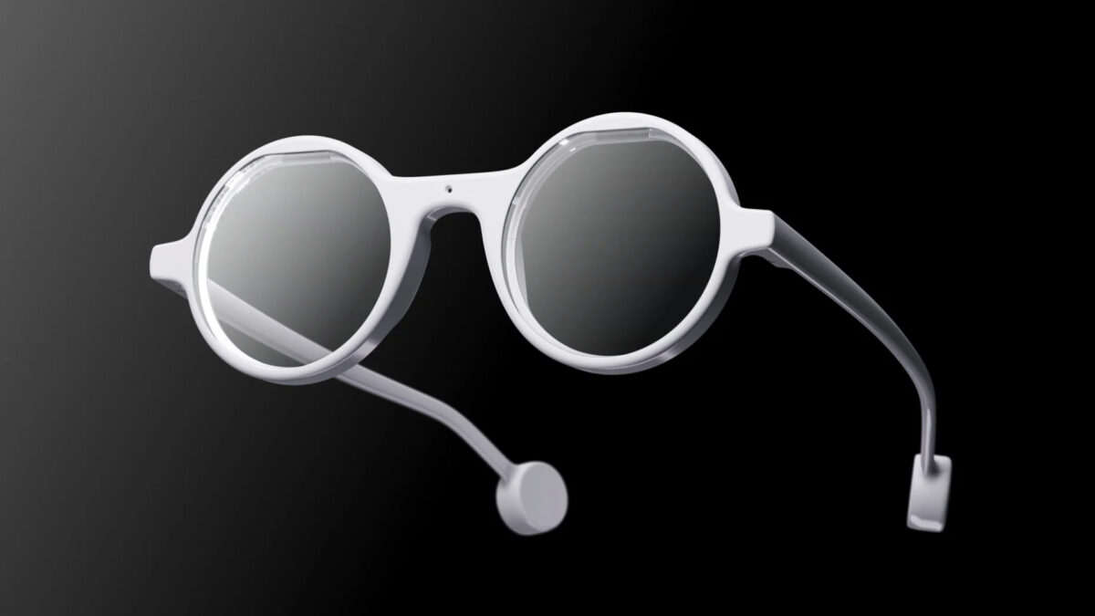 Die KI-Smartbrille Frame mit rundem hellem Design auf schwarzem Untergrund.