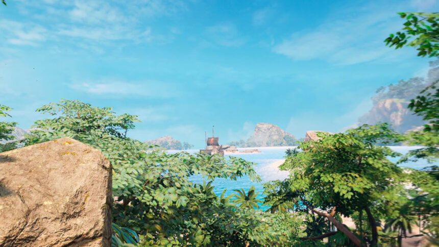 Der Ausblick von einer Klippe auf einer karibischen Insel zeigt Bäume einen blauen Himmel und eine Bucht, in der ein Schiff anliegt.